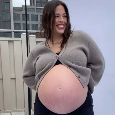 Model Ashley Graham showing off her pregnant belly with twins