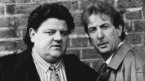 Robbie Coltrane and Eric Idle in "Nuns On The Run" September 20, 1990.