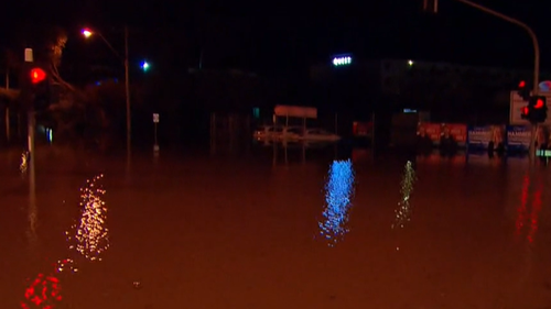 It was Shepperton scene at 5:30 this morning when the floodwaters began to engulf the traffic lights. 