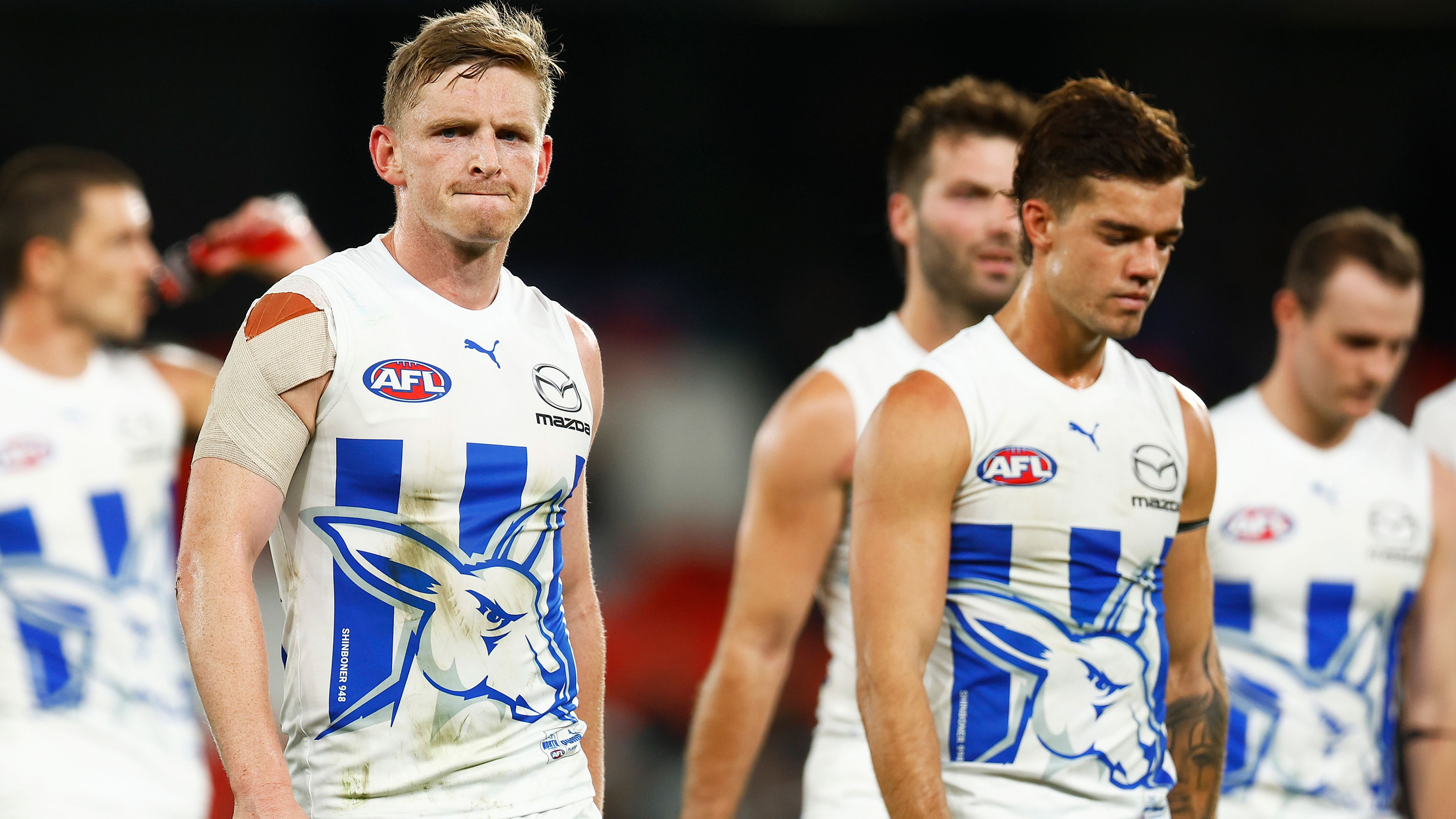 Jack Ziebell and Jy Simpkin of the Kangaroos look dejected after their loss against the Blues at Marvel Stadium in April. Photo: Daniel Pockett