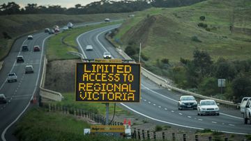 A traffic sign with restriction warnings stand on the Western Highway between Melbourne and Ballarat.