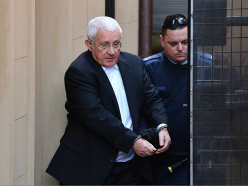 Medich is escorted to a NSW Corrective Services van. (AAP)