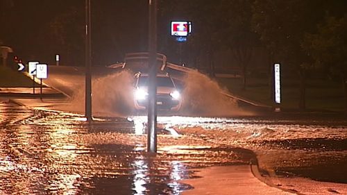 The rain saw floodwaters rise rapidly on streets in the area, leaving drivers forced to navigate inundated roads (Supplied).