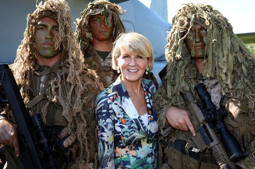 The minister poses for a picture with scout snipers from the 2nd Battalion, 4th US Marine Regiment. Picture: AAP