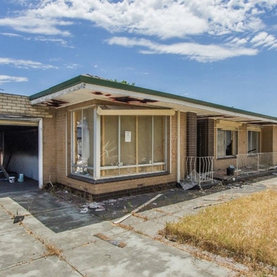 Fire-damaged Perth home for sale has no roof and soot on the walls