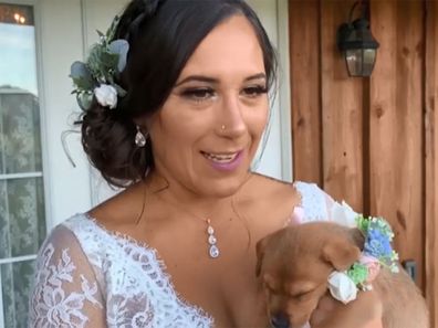 Bridesmaids ditch the flowers to carry puppies down the aisle