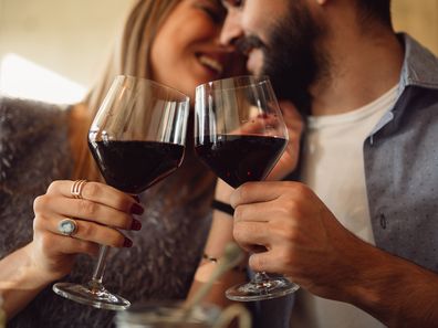 Woman and man drinking wine together