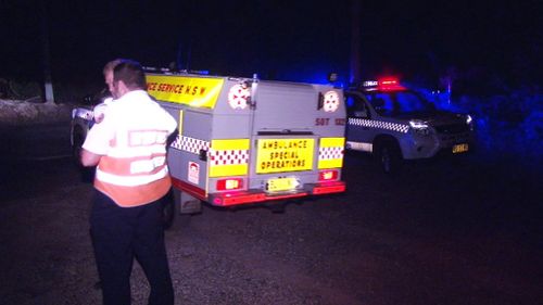 Ambulance officers and police made their way to the bottom of the cliff where they found the body. (9NEWS)