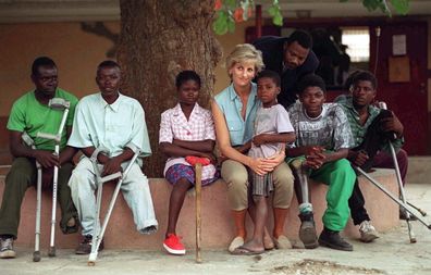 Diana, Princess Of Wales, With Children Injured By Mines At Neves Bendinha Orthopaedic Workshop In Luanda, Angola.  (Photo by Tim Graham Photo Library via Getty Images)