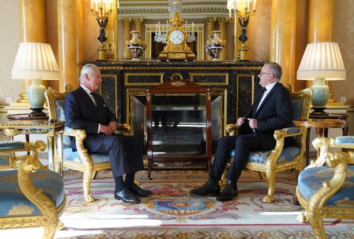 Britain's King Charles III speaks with Prime Minister of Australia, Anthony Albanese, as he receives realm prime ministers in the 1844 Room at Buckingham Palace.