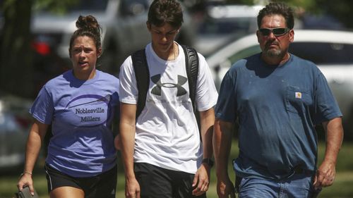 Parents and students at the scene near Noblesville High School. (AAP)