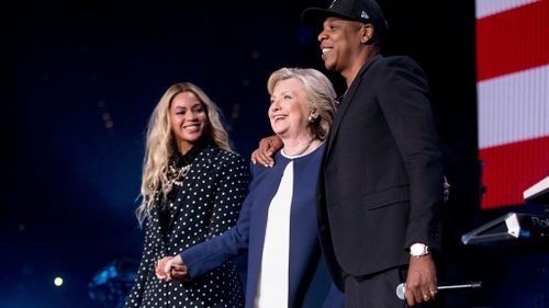 Jay-Z with wife Beyonce and US presidential candidate Hillary Clinton during her election campaign last year (Image: AP)