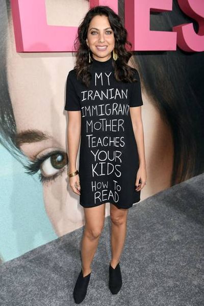 Actress Kathreen Khavari attended the premiere
of&nbsp;<em>Big Little Lies</em>&nbsp;in Los Angeles wearing a T-shirt dress with a political
message for Donald Trump, February, 2017
