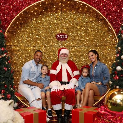 @zoebmarshall poses for a Christmas family photo with Santa 