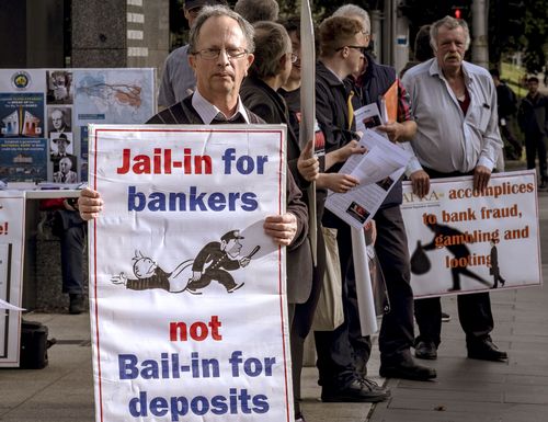 The new penalties could see dodgy bankers and finance executives face up to 10 years jail. Pictures are protesters outside the Royal Commission in Melbourne earlier this week. (AAP)