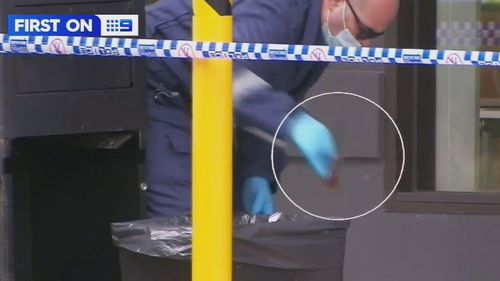 Police found a knife dumped in the carpark bin of a nearby McDonald's.