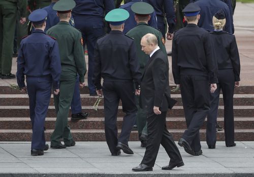 Russian President Vladimir Putin attends a wreath-laying ceremony at the Tomb of the Unknown Soldier in Moscow, Russia, on Wednesday, June 22, 2022, to mark the 81st anniversary of the Nazi invasion of the Soviet Union.