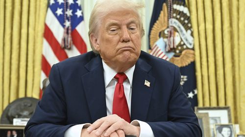 President Donald Trump speaks to reporters before signing an executive order in the Oval Office of the White House in Washington, Monday, March 31, 2025. 