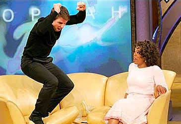 When did Tom Cruise famously leap on Oprah Winfrey's couch?