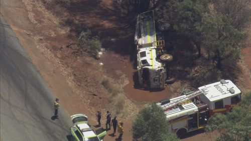 A firefighter was taken to hospital after a fire truck rolled en-route to Toodyay.