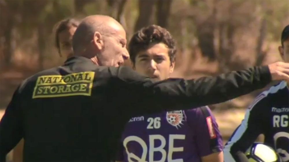 Perth Glory coach Kenny Lowe gives his players an almighty spray in front of cameras at training