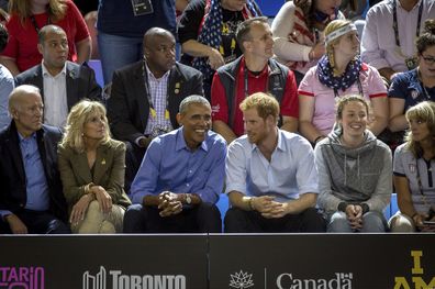 Barack Obama and Prince Harry watch wheelchair basketball at the Invictus Games in Toronto on Friday, Sept. 29, 2017. 