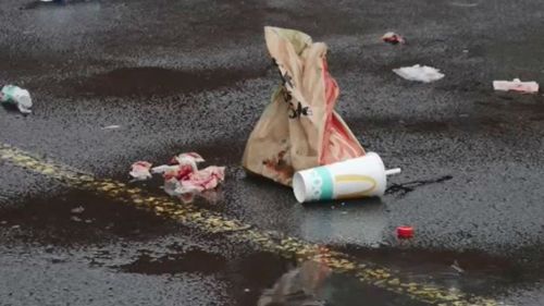 Rubbish strewn with blood after a brawl at a McDonalds in St Albans. (9NEWS)
