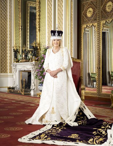 Queen Camilla poses for a photo in The Green Drawing Room of Buckingham Palace, London. The Queen is wearing Queen Mary's Crown and Robe of Estate. 