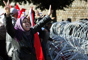 Protests in which country in 2010 triggered the Arab Spring uprisings?