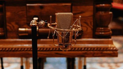 John Laws' golden microphone in front of the altar and his funeral in Sydney. 