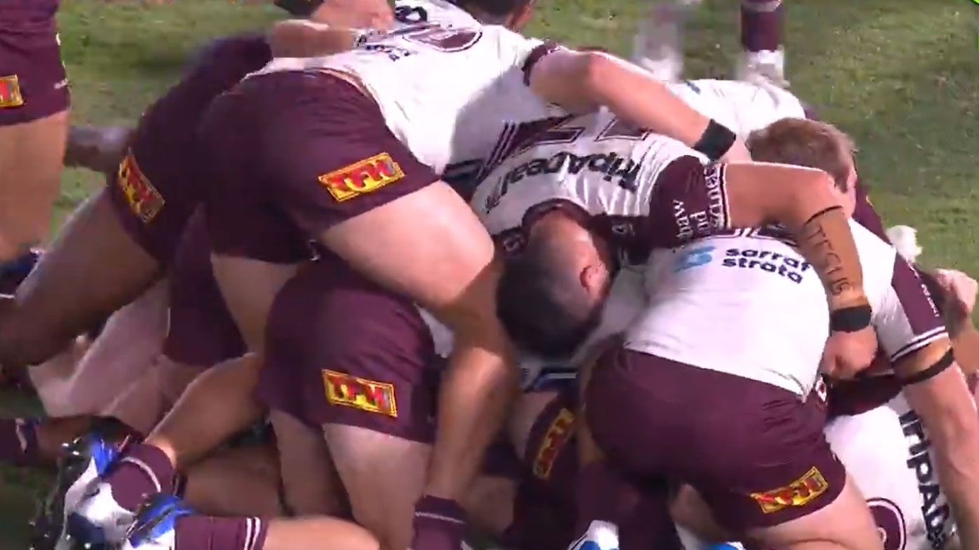 Daly Cherry-Evans is piled on by teammates after slotting a last-ditch field goal against the Warriors. (Twitter)