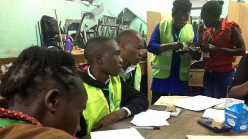 Election officials at a voting station in Nairobi. (Photo: AP).