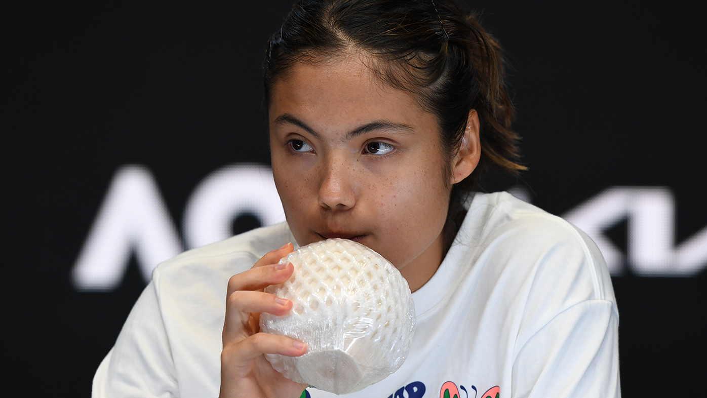 Emma Raducanu of Great Britain drinks a coconut water as she speaks to media after her round one singles match win against Tamara Korpatsch of Germany.