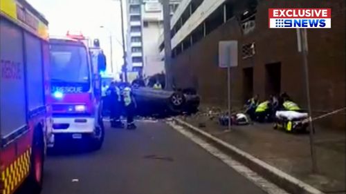 Sydney news Eastwood car crash shopping centre BMW flip