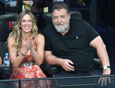 Russell Crowe  and girlfriend Britney Theriot watch the Womens Singles Final match between Elena Rybakina of Kazakhstan and Aryna Sabalenka during day 13 of the 2023 Australian Open at Melbourne Park on January 28, 2023 in Melbourne, Australia. 