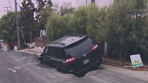 A sinkhole formed and swallowed up a parked minivan in the Berkeley Hills district of California.