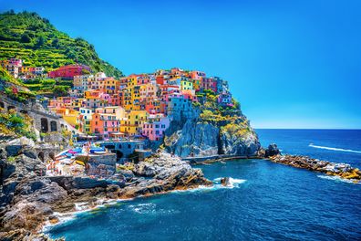 Beautiful colorful cityscape on the mountains over Mediterranean sea, Europe, Cinque Terre, traditional Italian architecture.