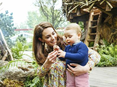 In this image made available on Sunday May 19, 2019 by Kensington Palace, Britain's Kate, Duchess of Cambridge and her son Prince Louis play in the Adam White and Andree Davies co-designed garden ahead of the RHS Chelsea Flower Show in London. (Matt Porteous/Kensington Palace via AP)