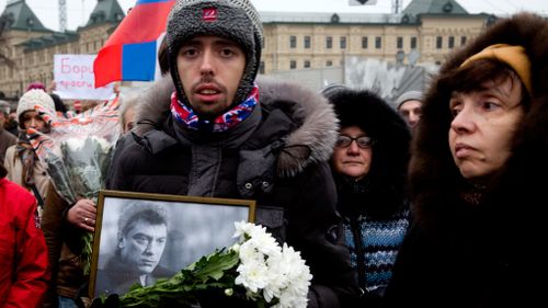 Protesters march against the death of Boris Nemtsov. (AAP)