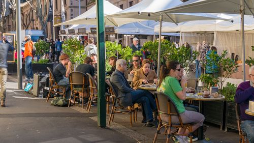 Sydney, Australia - July 23, 2016: People dining at outdoor restaurant in The Rocks precinct in Sydney