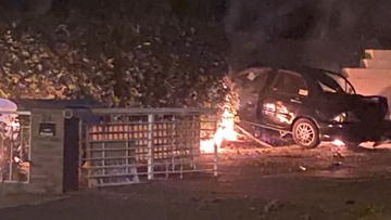 An allegedly stolen car hit a power pole and erupted in flames. 
