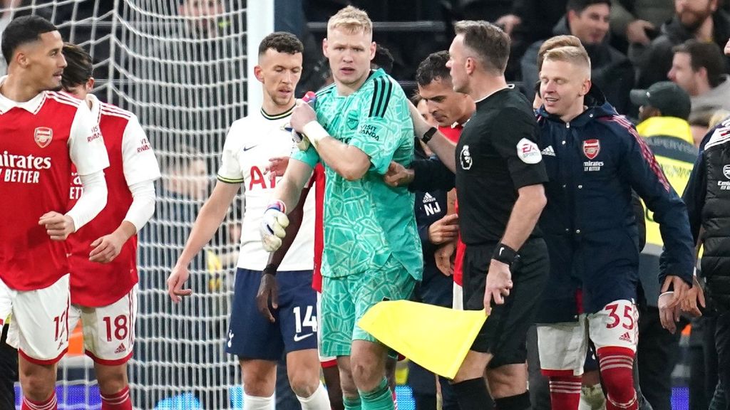 Arsenal goalkeeper Aaron Ramsdale appears to be kicked by