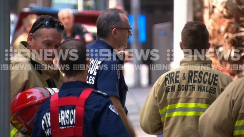 Firefighters outside the building, which also houses the office of the NSW Premier Gladys Berejiklian.