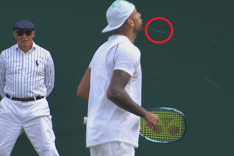 Nick Kyrgios spits in the direction of fans after his opening round win at Wimbledon.
