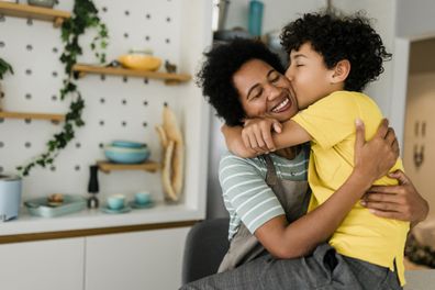 Smiling family in a hug, mother and young son.,  mother hugging her male child