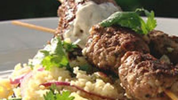 Bbq lamb koftas with spicy yoghurt and couscous salad