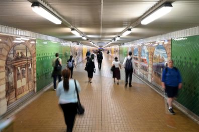 Pedestrians pass through Central Station in Sydney, Tuesday, March 24, 2020.