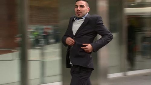 John Wassouf running into court in Melbourne today. (9NEWS)