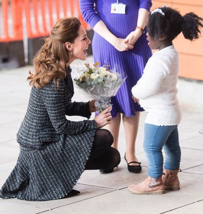 Kate accepting a posy from Anna-Victoria, nine. 