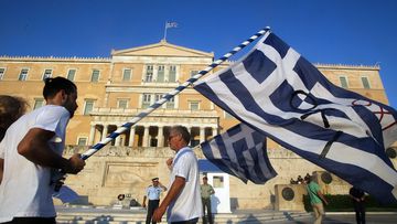 Greek protesters take part in a rally on first anniversary of Greek referendum on the third bailout in central Athens, Greece on July 5, 2016. (AFP) 